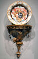 Porcelain charger with arms of Okeover family of England from Jingdezhen, China & wall bracket from Philadelphia at National Gallery of Art. Washington, DC.