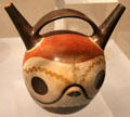 Wari ceramic stirrup-spout bottle painted with skull effigy from Peru at Dumbarton Oaks Museum. Washington, DC.