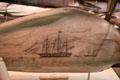 Scrimshaw panbone shows whale hunt of coast of Ternate in Indonesia at National Museum of American History. Washington, DC.