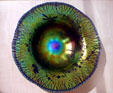 Iridescent glass bowl with dragonflies by Louis Comfort Tiffany at Lightner Museum. St Augustine, FL.