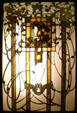 Austrian Art Nouveau colored glass window with woman's profile & vines at Lightner Museum. St Augustine, FL.