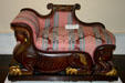 Renaissance-Revival lounge chair resting on Egyptian-style sphinxes from New York at Lightner Museum. St Augustine, FL.
