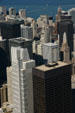 Area around Wrigley Tower & Chicago River with white Chicago Title & black Daley towers in foreground from Sears Tower. Chicago, IL.