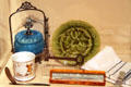Blue glass condiment container , green Majolica plate , & shaving mug & razor at Sedgwick County Historical Museum. Wichita, KS.