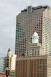 Modern CapitalOne Tower over octagonal tower of National American Bank & dome of Hibernia Bank Buildings. New Orleans, LA.
