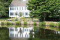 View of Newcomb house across Sandwich pond. Sandwich, MA.