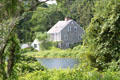 View of heritage house across Sandwich pond. Sandwich, MA.