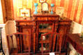 Display cabinet in music room at Gibson House Museum. Boston, MA.