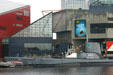 Submarine USS Torsk 423 at Baltimore Maritime Museum against National Aquarium. Baltimore, MD.