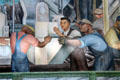 Workers moving auto parts on north wall of Detroit Industry Murals by Diego Rivera at Detroit Institute of Arts. Detroit, MI.