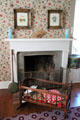 Cradle in front of master bedroom fireplace at John Wornall House Museum. Kansas City, MO.