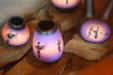 Native designs on pottery in shop window. West Yellowstone, MT.