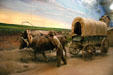 Diorama of settlers with covered wagon at Kearney Arch. Kearney, NE.