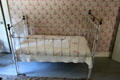 Metal frame crib at Robert Frost Farm. Derry, NH.