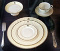 Stickley family porcelain dinner service with Als Ik Kan crest at Stickley Museum at Craftsman Farms. Morris Plains, NJ.