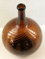 Glass Midwestern corn whiskey swirl flask by Zanesville Glass. of Zanesville, OH at Museum of American Glass. Milville, NJ.