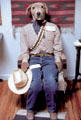 Western dog with bandoleer of bones in shop in Chimayo. NM