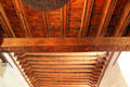 Ceiling beams span adobe walls of San Miguel Mission church. Santa Fe, NM.