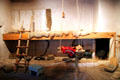 Kitchen with shepherd's fireplace with cooking done below & sleeping shelf above at Hacienda de los Martinez. Taos, NM.
