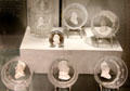 Glass tumblers with ceramic portraits of American leaders Ben Franklin, George Washington, Andrew Jackson, Gen. Lafayette by Bakewell glasshouse at Corning Museum of Glass. Corning, NY.