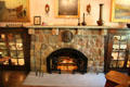 Living room fireplace with flanking enclosed bookcases at Elbert Hubbard Roycroft Museum. East Aurora, NY.