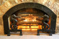 Seahorse andirons of living room fireplace at Elbert Hubbard Roycroft Museum. East Aurora, NY.