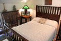 Roycroft slant-front desk, table lamp & bedstead at Elbert Hubbard Roycroft Museum. East Aurora, NY.