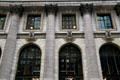 Lions over arched windows of New York Public Library. New York, NY.
