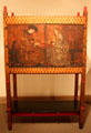 Cabinet decorated with painting of Backgammon Players by Philip Webb at Metropolitan Museum of Art. New York, NY.