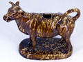 American earthenware creamer in shape of cow at Brooklyn Museum. Brooklyn, NY.