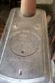 Antique cast iron Pine Knot wood stove by J.L. Mott Iron Works of New York in Layton General Store at Old Bethpage Village. Old Bethpage, NY.