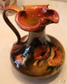 Earthenware ewer by Amelia Browne Sprague of Rookwood Pottery Co. of Cincinnati at Cincinnati Art Museum. Cincinnati, OH.