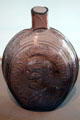 Mold blown glass flask with bust of Benjamin Franklin from Kensington, PA at Toledo Glass Pavilion. Toledo, OH.