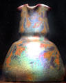 Earthenware vase with iridescent vines by Weller Pottery of Zanesville, OH at Cleveland Museum of Art. Cleveland, OH.