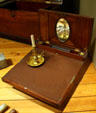 Lap desk & gimbaled candleholder at Columbia River Maritime Museum. Astoria, OR