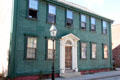 Green Federal style house with white front door surround. Newport, RI.