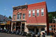 1892 building beside moderne-style 1930s building. Deadwood, SD.
