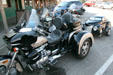 Motorcycle with trailer in shape of small car. Wall, SD.