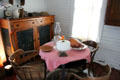 Kitchen with pie safe in Yates House at Sam Houston Park. Houston, TX.