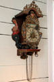 Carved German wall clock in San Felipe Cottage at Sam Houston Park. Houston, TX.