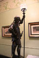 Bronze guilt warrior lamp brought back by the Steves from visit to Centennial Exhibition in Philadelphia on newel post in central hall at Edward Steves Homestead Museum. San Antonio, TX.