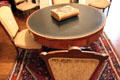 Round renters' table where each boarder had a locked drawer for personal storage in parlor at McCulloch House. Waco, TX.
