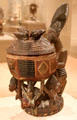 Wood kneeling female figure with bowl by Ekiti Yoruba culture of Southwestern Nigeria at Dallas Museum of Art. Dallas, TX.