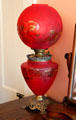 Red glass oil lamp at Neill-Cochran House Museum. Austin, TX