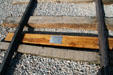 Last rail tie lies under track where Union Pacific & Central Pacific joined to complete Transcontinental Railroad at Promontory Point NHS. UT.