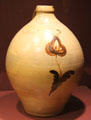 Stoneware jug colored with ochre instead of cobalt by Luman Norton & Sons Pottery of Bennington, VT at Bennington Museum. Bennington, VT.