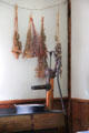 Herbs hung over metal water pump in kitchen in birthplace house at President Calvin Coolidge State Historic Park. Plymouth Notch, VT.