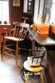Barber shop with elevated chair with headrest & swivel child's chair in General Store at Shelburne Museum. Shelburne, VT.