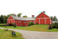 Horseshoe barn holds large collection of horse-drawn vehicles at Shelburne Museum. Shelburne, VT.