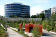 Sculptures against low rises around at Olympic Sculpture Park. Seattle, WA.